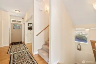 Main floor entry. Stairs up lead to bedrooms and down to the finished daylight basement.