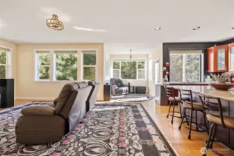 Living, kitchen, dining combo. Comprised of smaller nooks for some feeling of division of space.