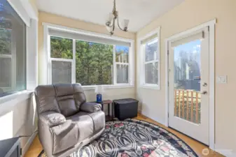 Dining area with door that leads out to the yard.