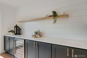 Counter space is not problem here, with the expanded galley kitchen stretching into the dining this is an entertainers dream space. Open bright and gorgeous quartz slab counters are the backdrop to this beautiful dining room!