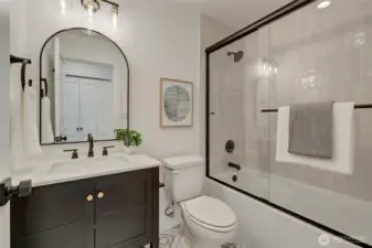 Perfectly appointed hall bath with stunning new materials and designer tile. Full bath features, all the necessary elements to make this space a show-stopper.