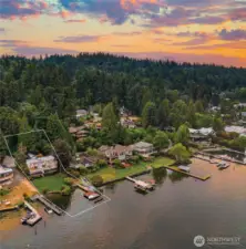 This exceptional waterfront home boasts 85' of prime lake frontage on a sprawling 0.58-acre lot. The rectangular lines are for demonstration purposes only and do not represent the actual property lines. The neighbor's renovation is near completion.