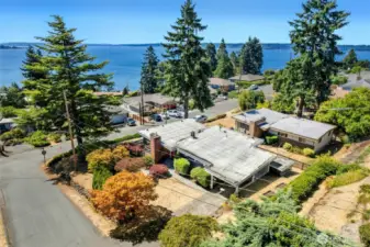 Located in the heart of Shorewood on the Sound on a private corner lot, this home offers beautiful Sound, Island and coastline views.