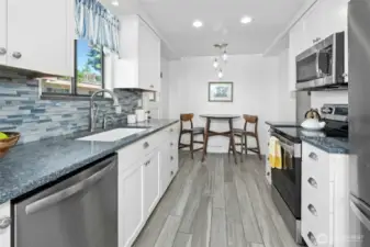 The kitchen was remodeled in 2018 and all appliances replaced over the last couple of years. And yes, there is room to open it up to the living space, if desired.