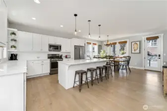 Gourmet kitchen adjacent to front entry