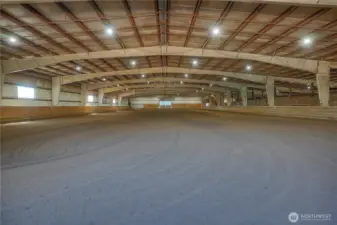 One of the larger indoor arenas in the PNW - The Flying M Stables offers, an obstacle trail course, jumps & rails, gaming equipment & a timer with barrel laser eyes mounted to the ceiling for the turn key equestrian event center.