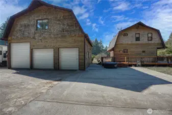 View of the residence! 1,377 Sf two story home, wrap around deck and detached garage with upper bonus room.
