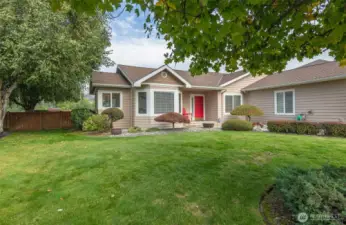 Mature trees & attractive landscape surround this lovely home.