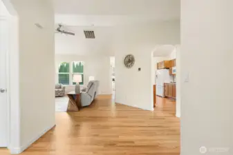 Inviting entry with an open layout and beautiful hardwood floors flowing throughout