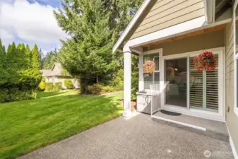 Inviting patio area with low-maintenance, HOA-maintained landscaping.