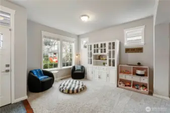 Entrance/ Living room with plenty of natural lighting .