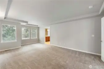 Primary bedroom with double doors , Coffered, Ceilings And Tiled in 5 Piece Oasis Bathroom