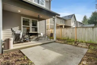 Fully Fenced Backyard with raised garden beds