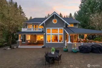 Enough cannot be said about the outdoor spaces and their versatility for gatherings of any size.  The private balcony off the primary bedroom and the covered Ipay deck below are perfect for a quiet cup of coffee.  The wrap around veranda awaits on a peaceful misty evening, and the cobblestone patio has limitless possibilities.