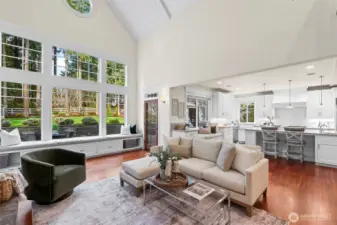 Hamptons inspired great room with vaulted ceilings opening to the kitchen.  Huge windows ensure there is always plenty of light.  The glass door leads to a covered deck (constructed with Ipay).
