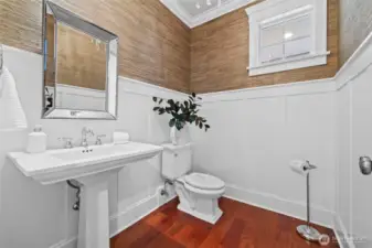 One of two powder rooms on the main level - this one is clearly a showpiece for guests with bamboo textured walls and wainscotting.  The other powder room is accessible from the laundry room.