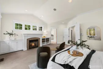 The vaulted primary retreat offers a peaceful "stay awhile" atmosphere, complete with a private fireplace and bespoke built-ins. Dual doors lead to a private deck for morning coffee overlooking the 1.4-acre grounds.