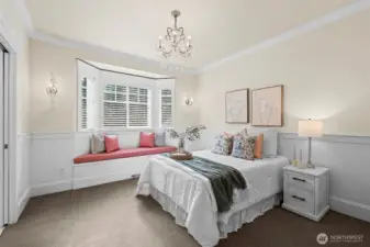 Elegance resides in every detail, from the crystal chandelier to the built-in window seat. This refined guest suite exemplifies the home's mint-condition craftsmanship and sophisticated coastal flair.