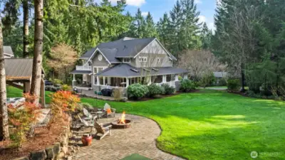Relax on a peaceful evening around the fire as the dogs and kiddos fetch and play ball in the expansive yard