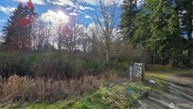 Shared driveway; property located left of the gate.