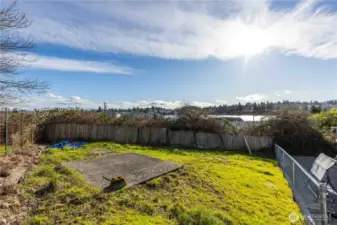 Grass Area in the backyard with peakaboo water and mountain views.
