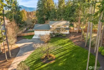 Set on a shy acre is this prized and private home.