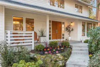 A newly minted concrete pathway and front porch invites you in.