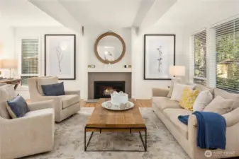 The living room offers clean architectural details from the fireplace to open beams.