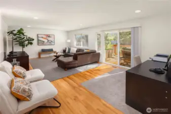 Hardwood floors grace both floors. Sliders provide and additional connection to the rear deck and yard.