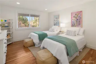 Spacious bedrooms with hardwood floors.