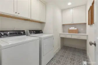 Love a fun tile and storage in the laundry.