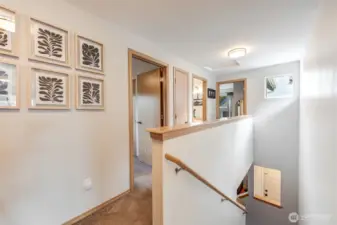 Upstairs to bedrooms and additional bathrooms