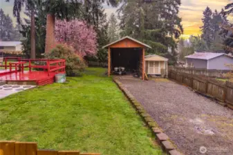 672 sqft carport for RV, Boat, etc. plus extra parking secured behind gate.