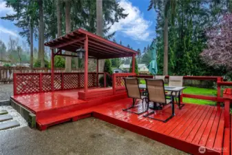 Mature fir trees and a flowering plum within view