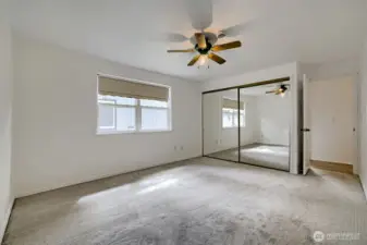 Primary with large mirrored closet doors