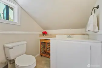 Half bathroom in the primary bedroom.