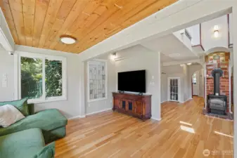 Unique details throughout help to give this home its charm, like the brick chimney seen here from the living room.