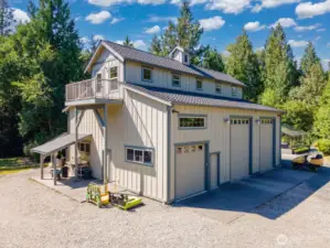 Another view of the spacious shop of 2,280 sf with loft storage and there is also a covered dog run along the back side of this building.