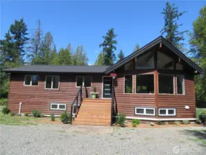 4104 Loomis Trail Rd. Exuberant modern architecture meets the forest!