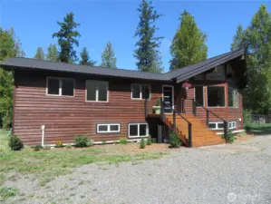 Private, situated on five level acres surrounded by trees, the surrounding area will not be developed.