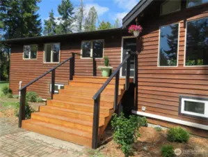 Wide stairway leads to the upper level - stylish finishes and architectrual inrigues.