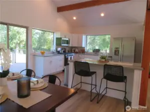 Wood beams in the kitchen also bring the forest feel into this area.