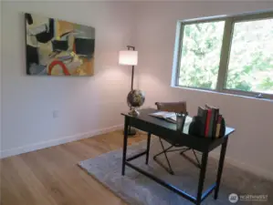 Third upper level bedroom facing the back of the home and staged here as an office space.