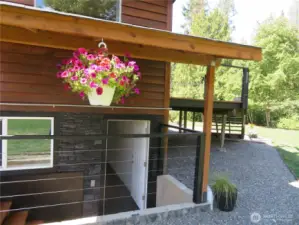 The lower level is unfinished and has its own two separate exterior entries.  This is the main entry on the east side of the home.