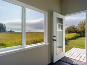 Sunroom opens to a little back porch.