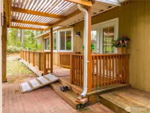 Covered entry to the home from the carport side.