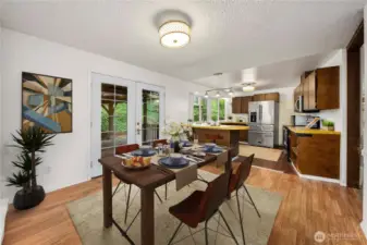 Virtually staged eat-in area of kitchen.