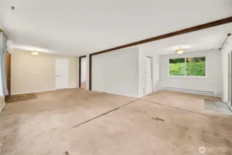 Wide view of the dining and living rooms.