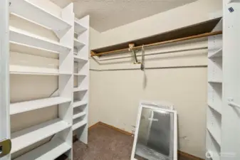 Walk-in-closet comes with built-in shelves and room to add your touches.