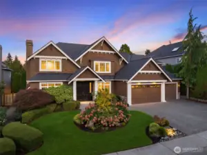 Beautiful curb appeal with professional landscaping and a 3 car garage